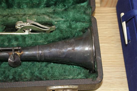 A Gladiator silver plated clarinet, cased